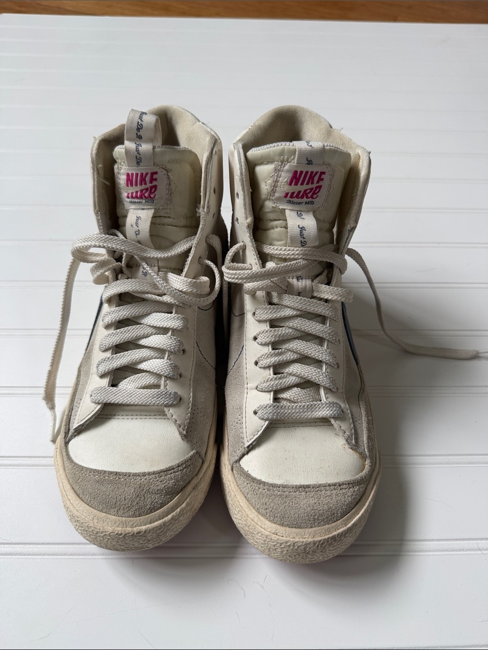 Nike Blazer Mid Top Sneakers in White and Blue Swoosh